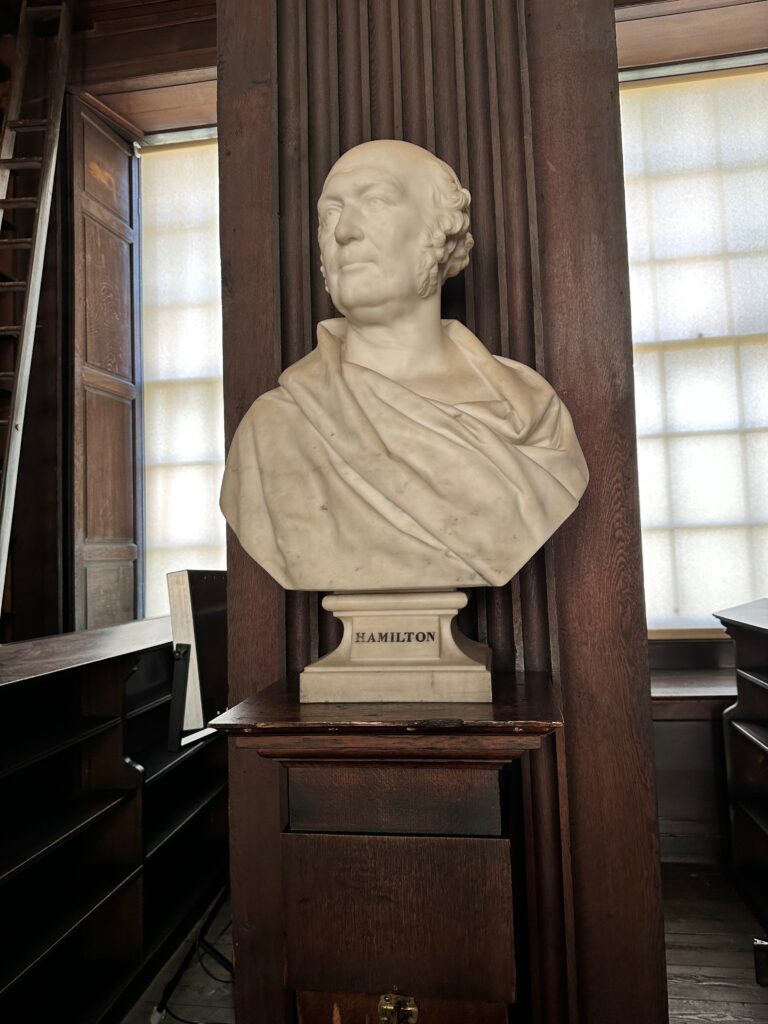 A close up of one of the busts of Hamilton at Trinity Library in Dublin. 