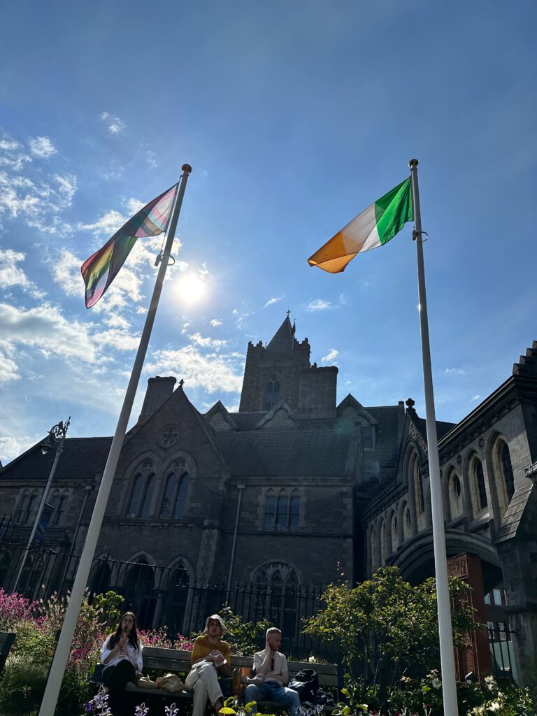Flags of Ireland in front of beautiful cathedral. 