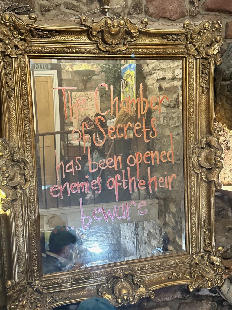 A mirror saying "The Chamber of Secrets has been opened enemies of the heir beware" 